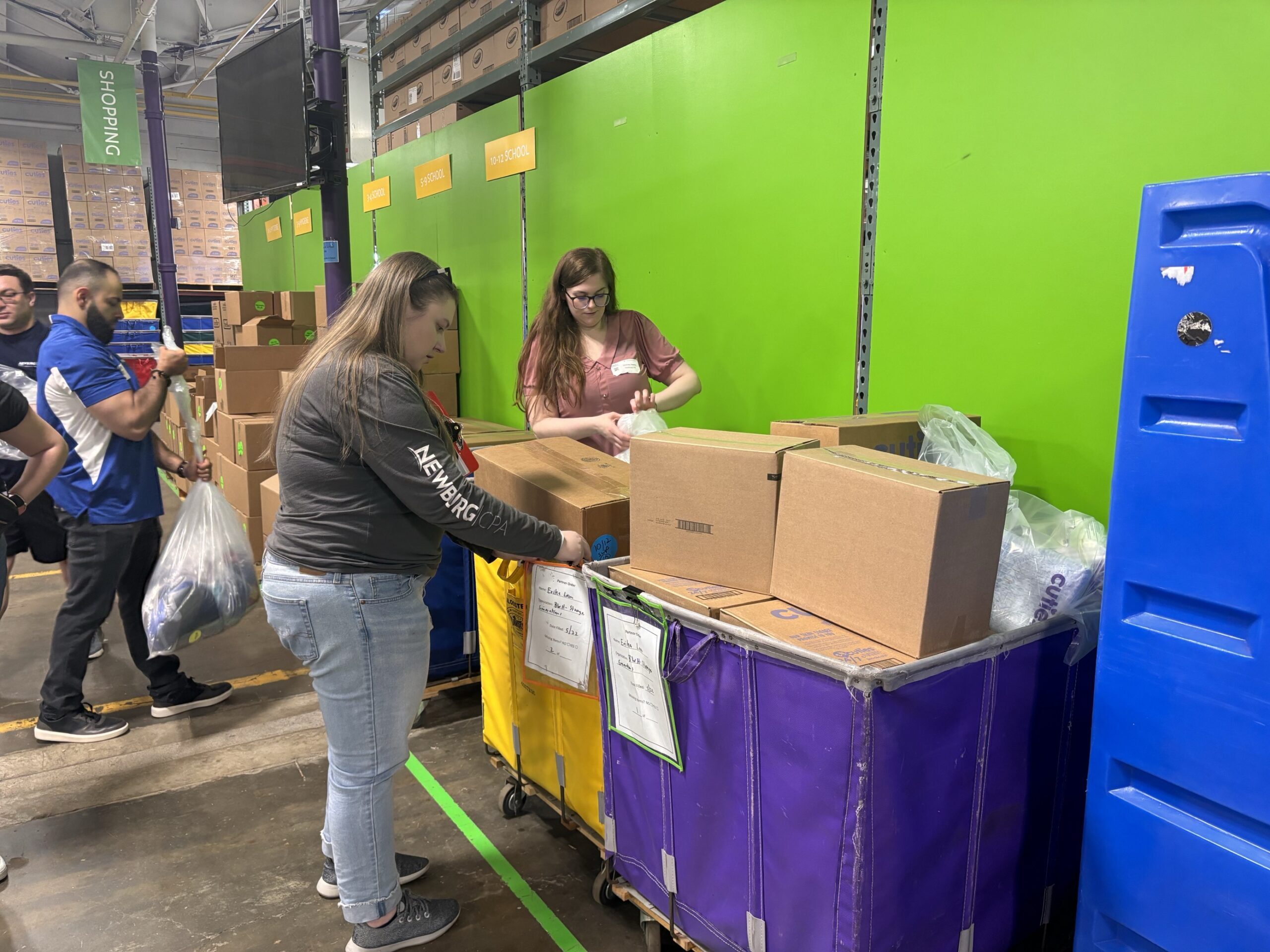 Catie & Des Newburg | CPA - Images of our team volunteering at Cradles to Crayons