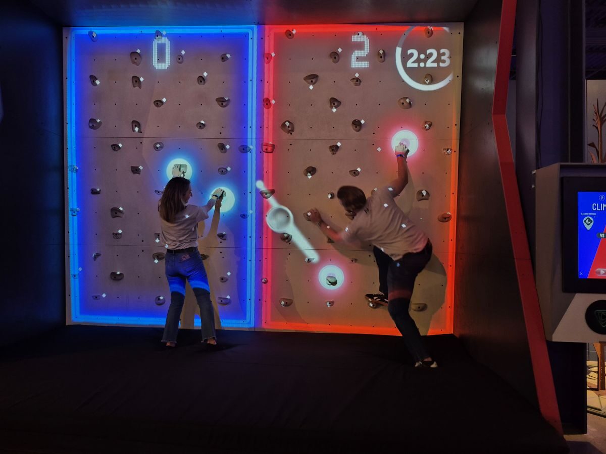 People climbing an indoor rock wall People climbing an indoor rock wall