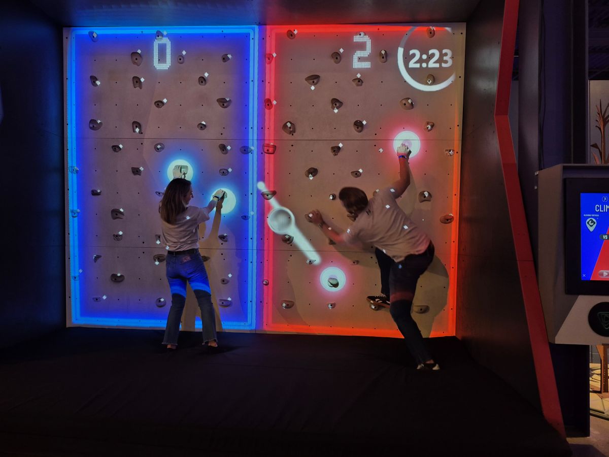 People climbing an indoor rock wall
